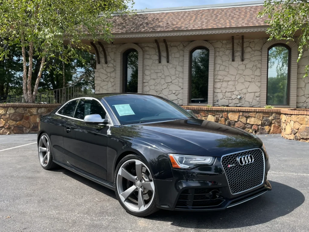 2014 Audi RS5 black exterior at AutoPro Nashville, showcasing a sleek design and aggressive stance.