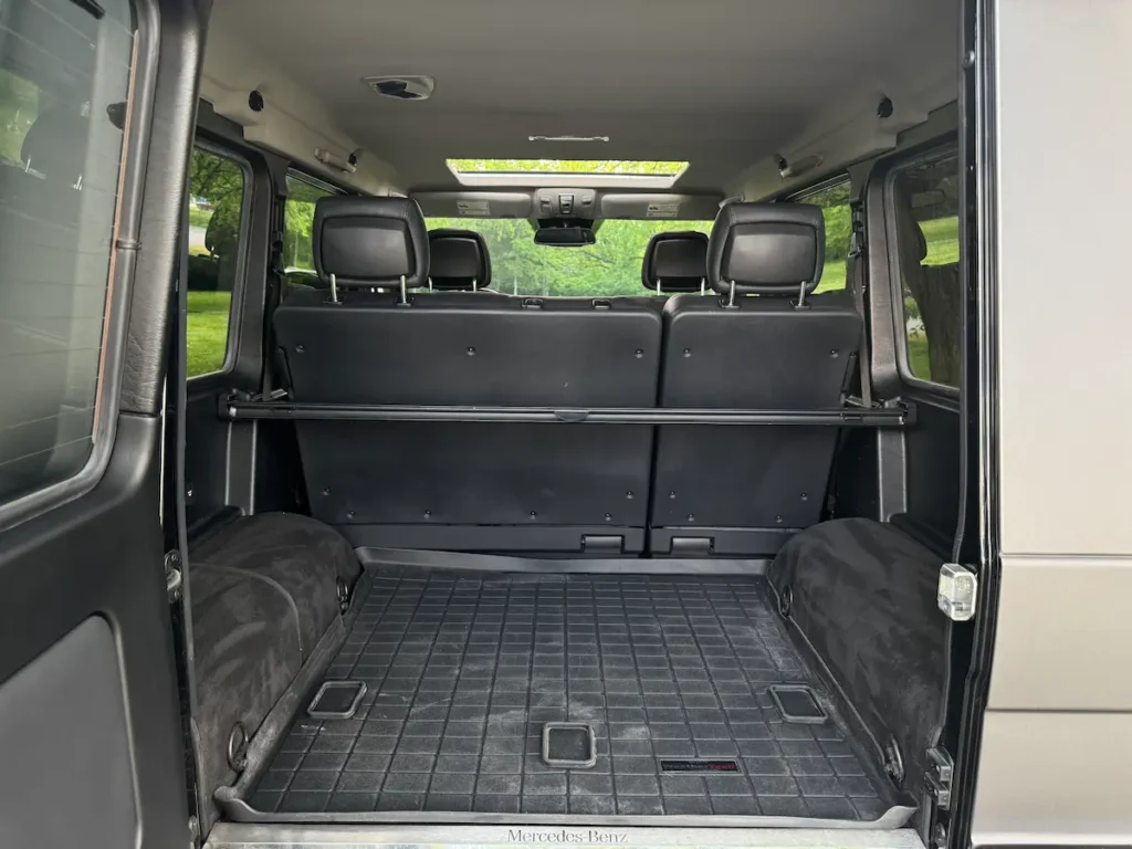 2016 Mercedes-Benz G550 cargo space with rear seats upright and rubber floor mat