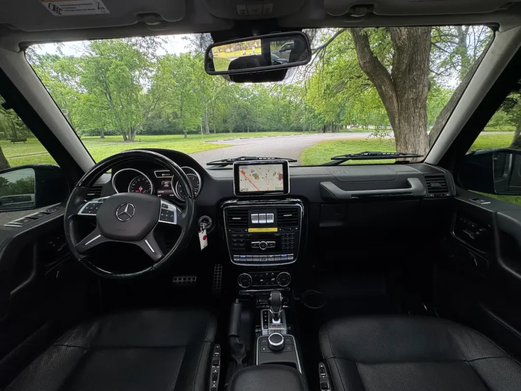 2016 Mercedes-Benz G550 interior dashboard with analog gauges and center infotainment screen