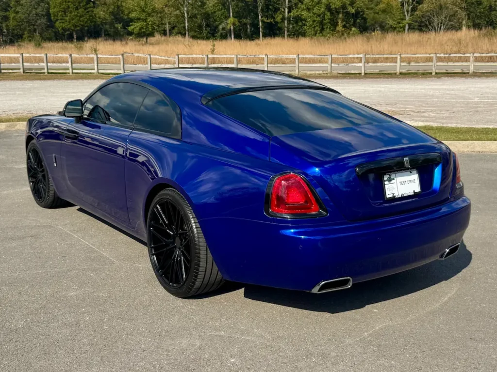 Rear exterior view of a blue 2016 Rolls-Royce Wraith