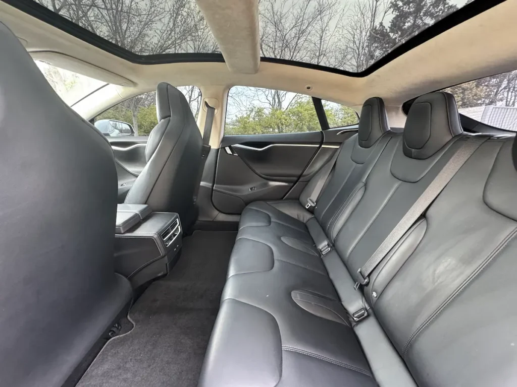 Rear passenger seating of 2017 Tesla Model S 90D with glass roof