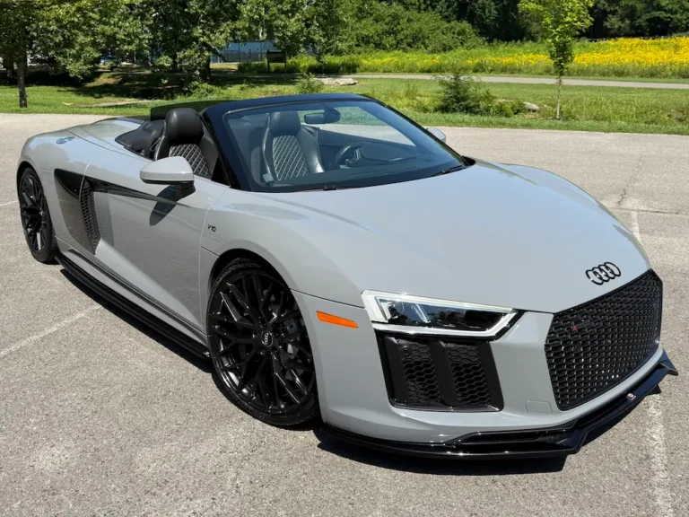 2018 Audi R8 V10 convertible in gray with black wheels, premium performance sports car.