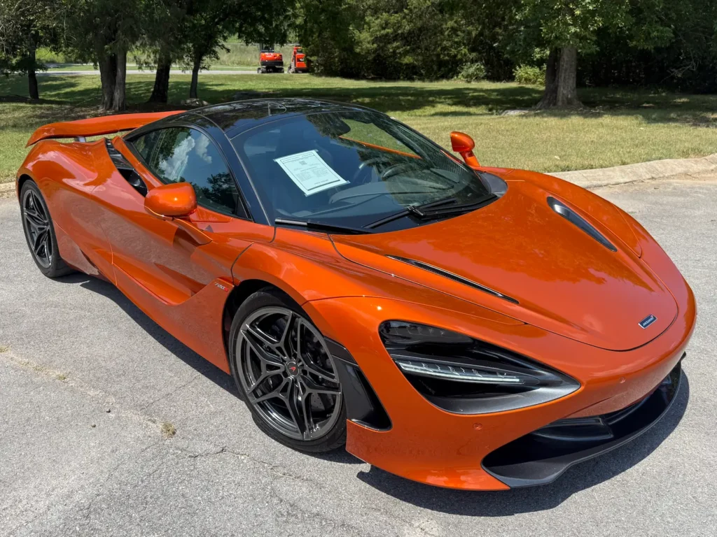 2018 McLaren 720S Luxury in vibrant orange with sleek aerodynamic design parked outdoors.