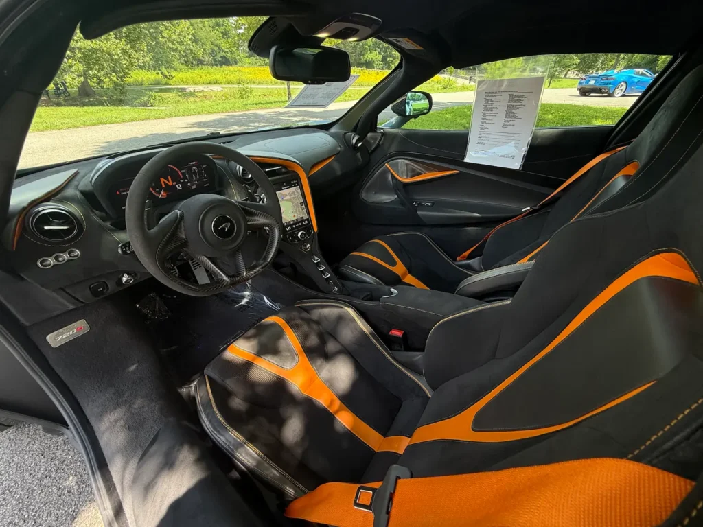 Interior of 2019 McLaren 720S Performance with black and orange Alcantara seats.