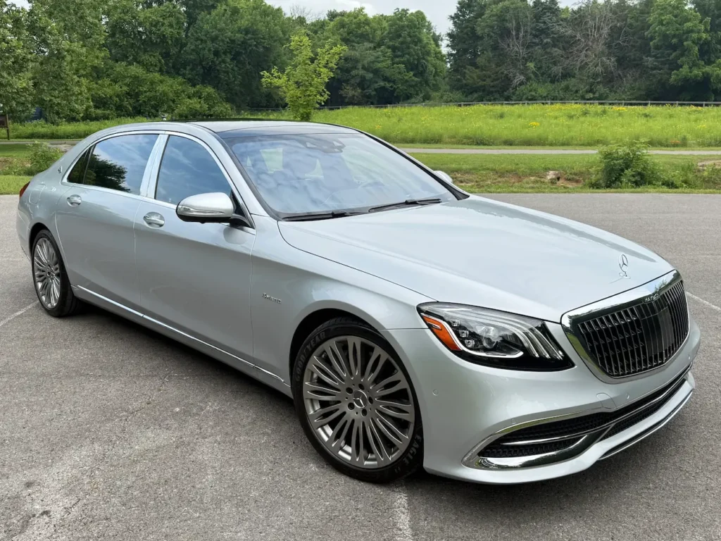2019 Mercedes-Benz S560 Maybach in silver showcasing its signature chrome grille and LED headlights.