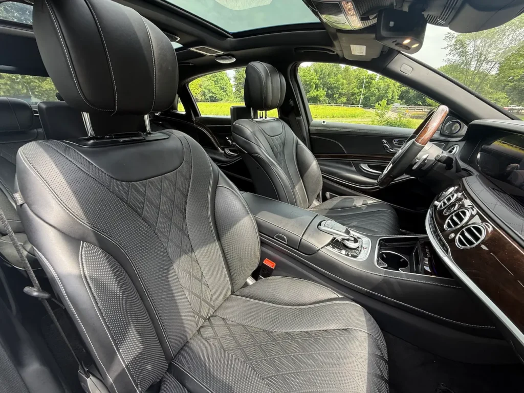 Close-up of 2019 Mercedes-Benz S560 Maybach front seats with quilted leather upholstery and contrast stitching.