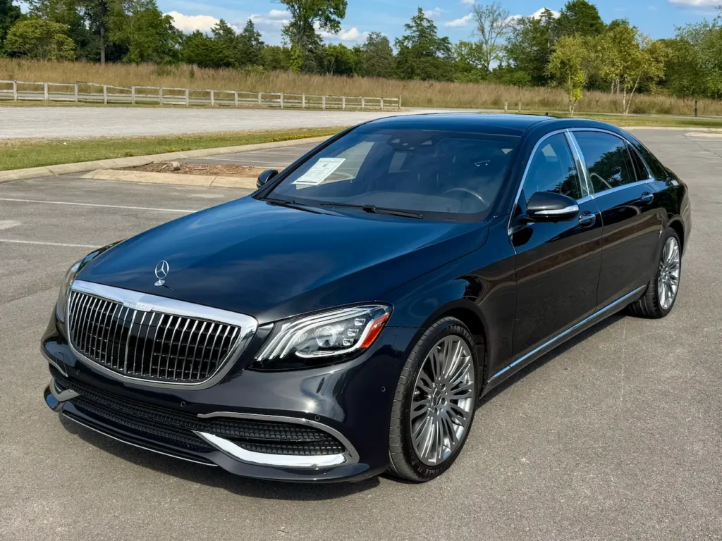 2020 Mercedes-Benz S650 Maybach black sedan front view with chrome grille and LED headlights.