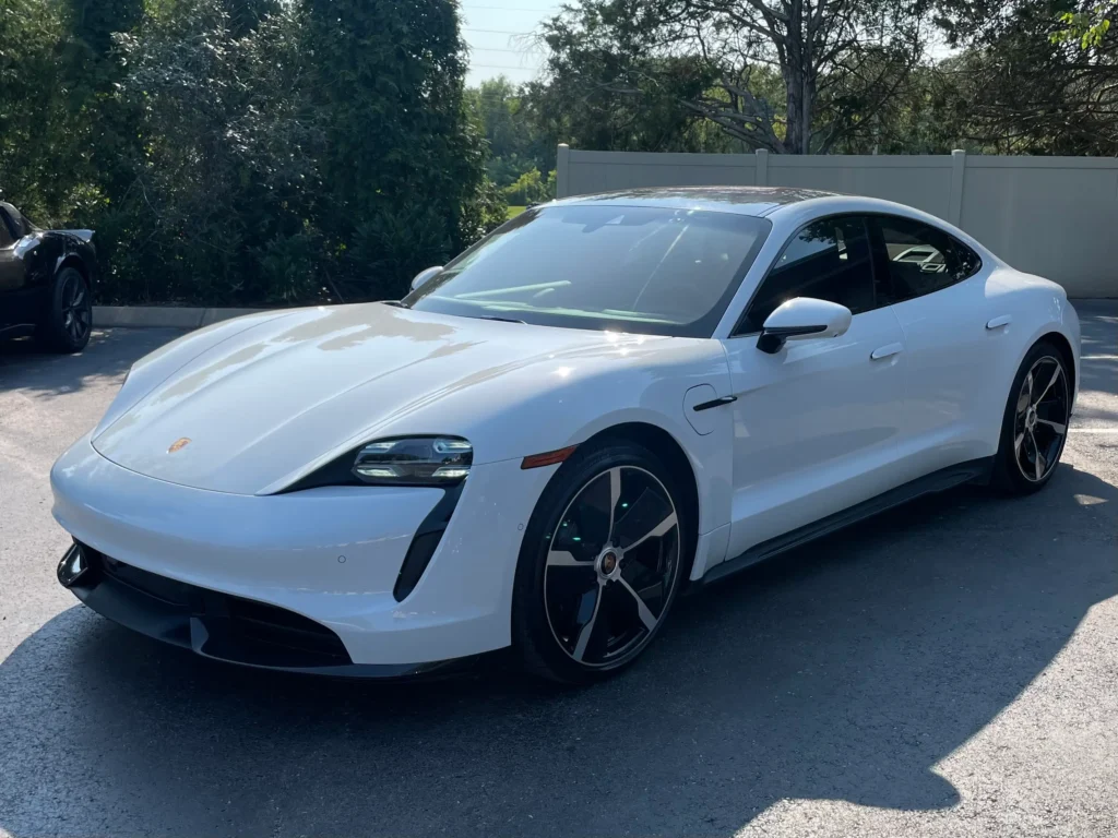 2020 White Porsche Taycan electric car available at AutoPro Nashville.