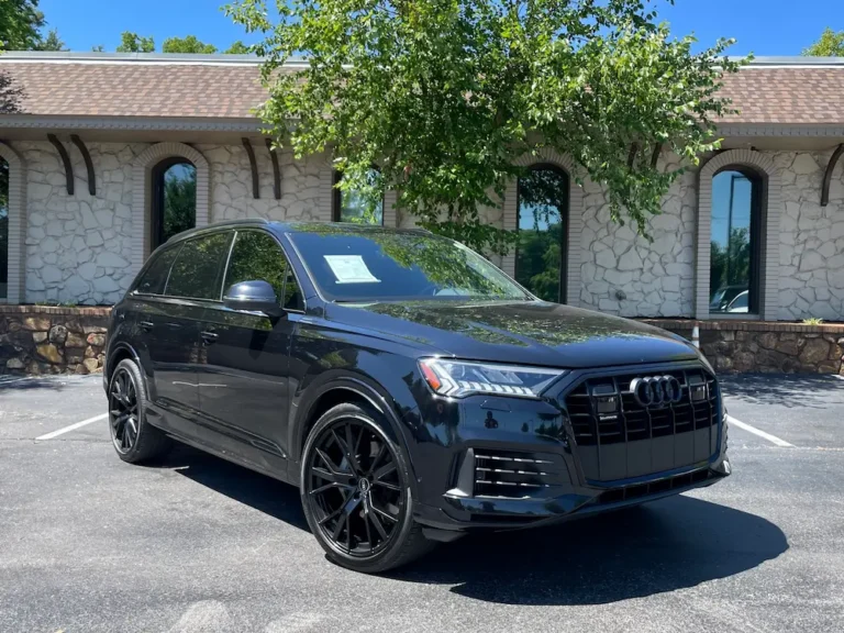 Front exterior angle of 2021 Audi Q7 Prestige 55 TFSI in black with Black Optic Package