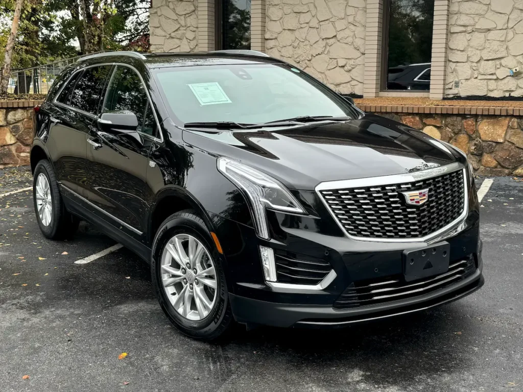 Front angle view of a black 2021 Cadillac XT5 featuring signature grille and LED lighting.
