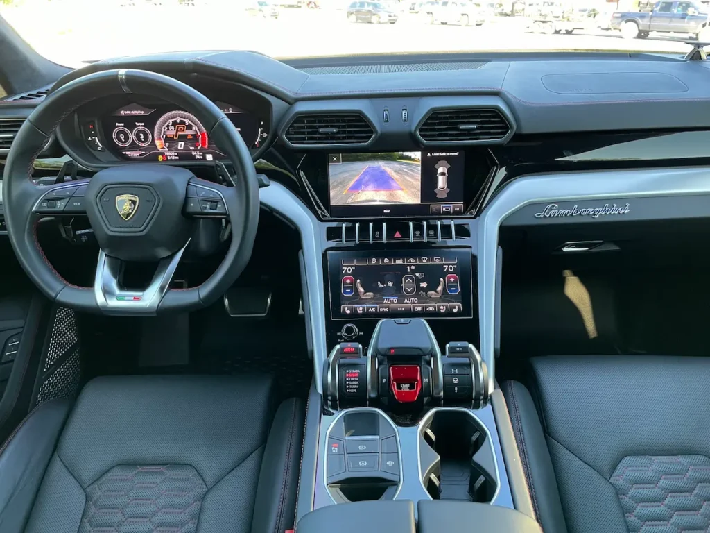Front interior of a 2021 Lamborghini Urus with digital cockpit