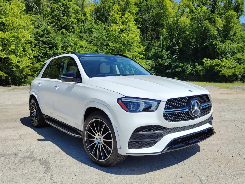2021 Mercedes-Benz GLE 450 front angle in white with signature grille and LED headlights.
