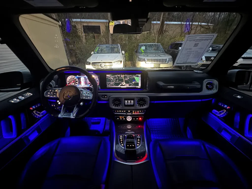2021 Mercedes-AMG G 63 interior with digital display and blue ambient lighting