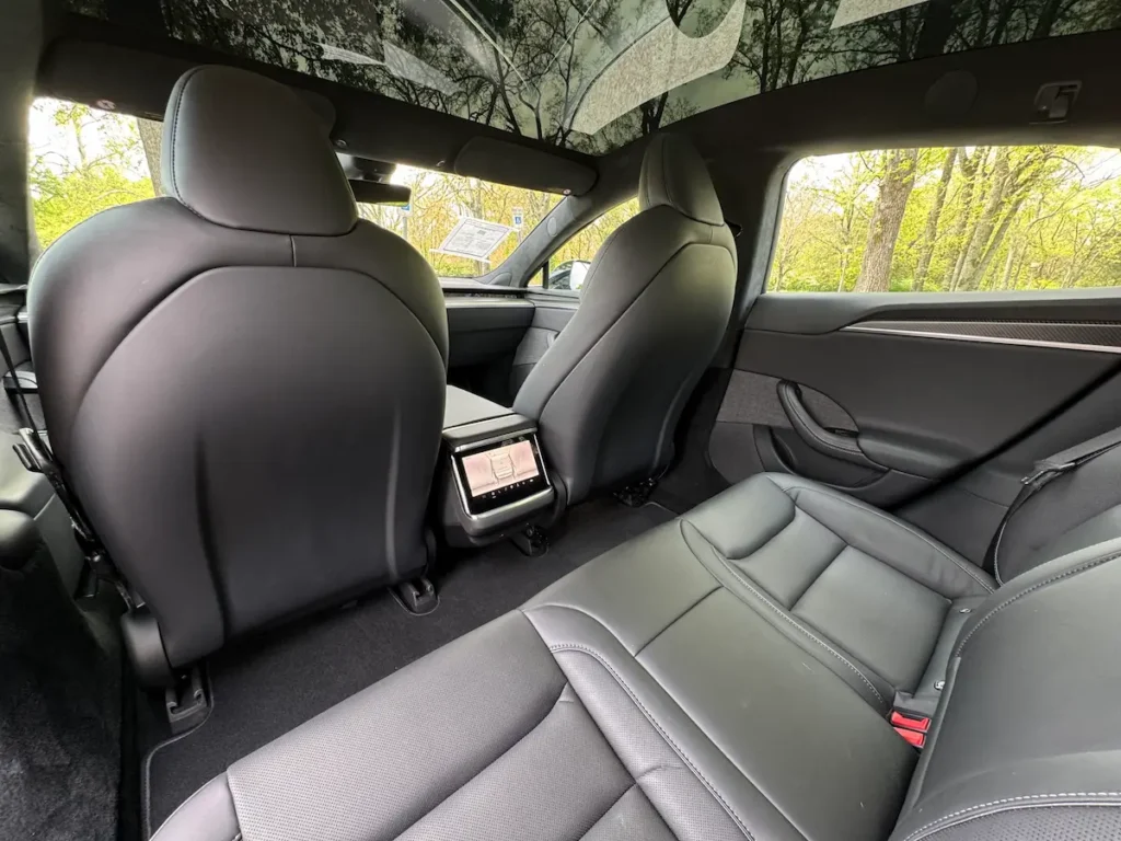 Rear passenger seating of 2021 Tesla Model S Plaid with rear screen
