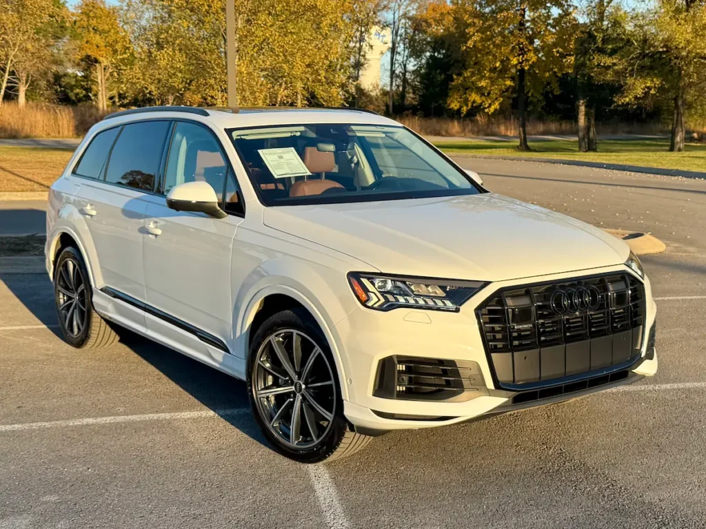 2022 Audi Q7 in white shown from front angle with LED headlights and black grille.