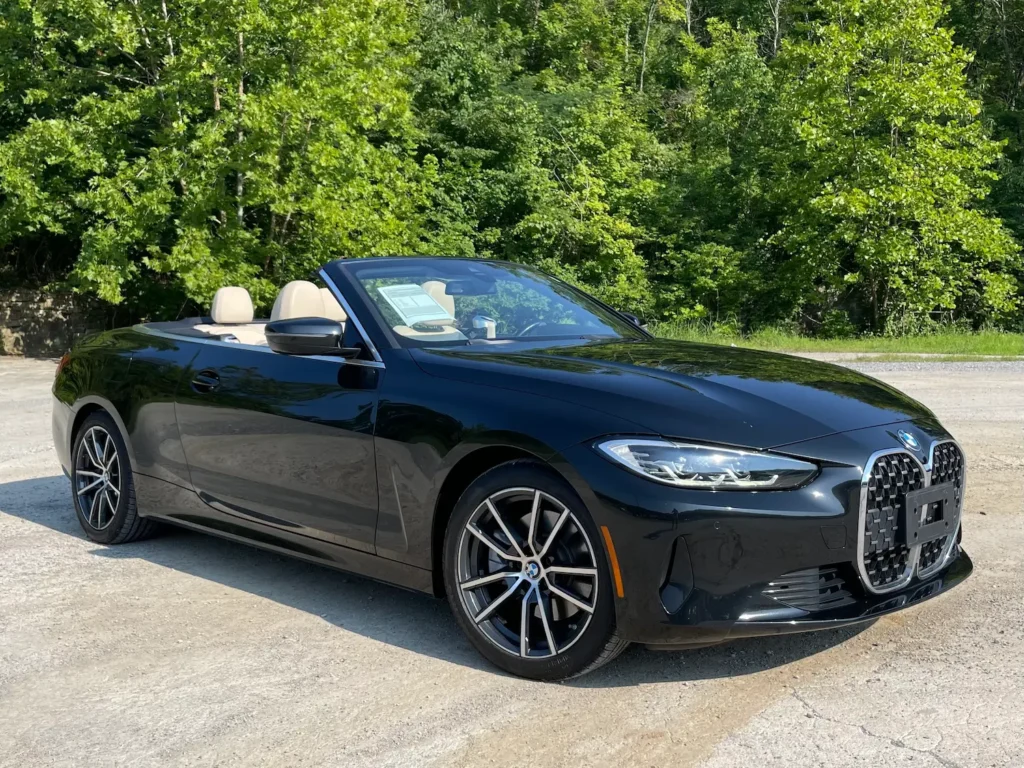 2022 BMW 430i Convertible with beige leather seats and advanced digital dashboard.