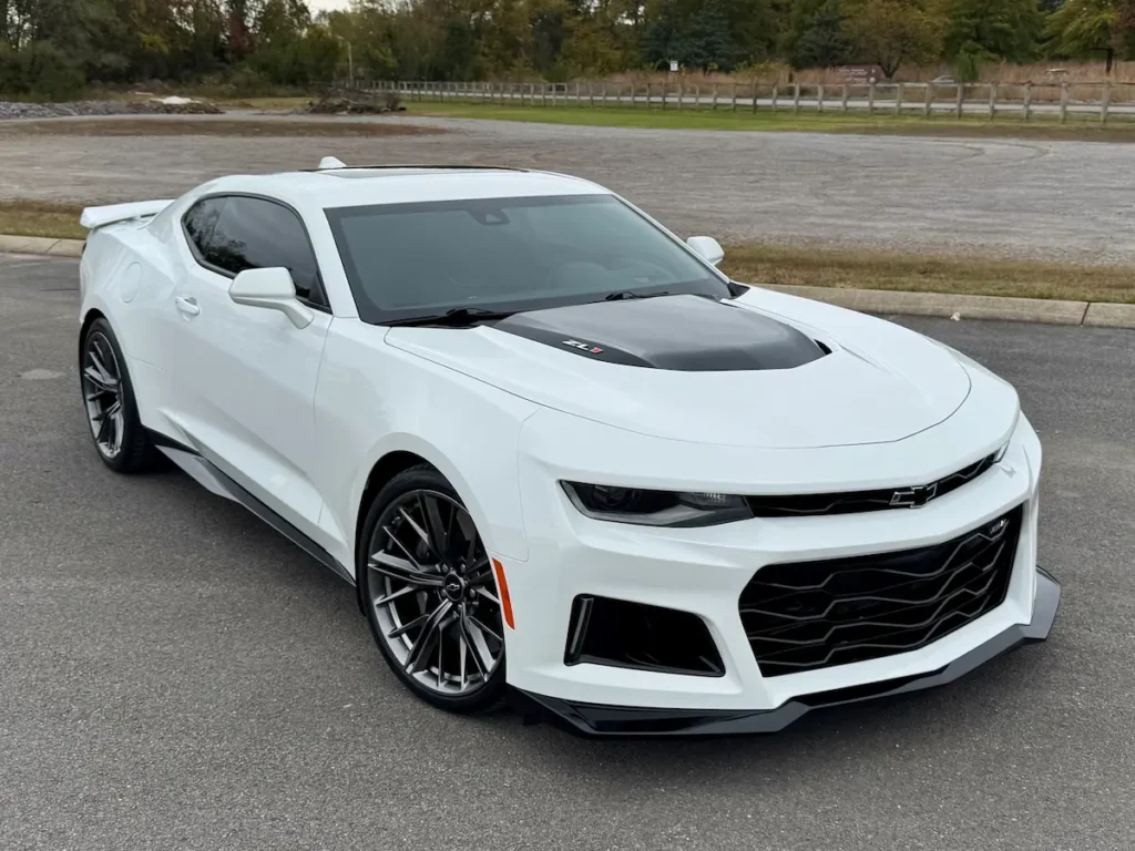 2022 Chevrolet Camaro ZL1 in white with black hood accents parked outdoors at AutoPro Nashville.