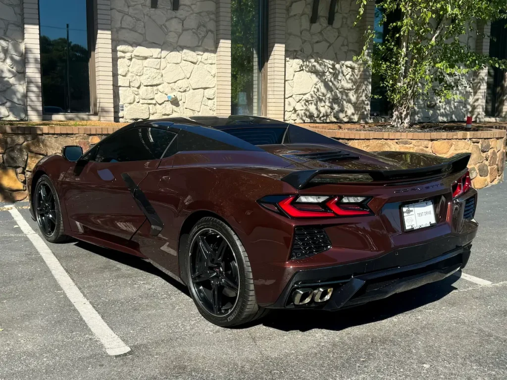 Rear and side view of a 2022 Chevrolet Corvette Stingray Convertible 3LT Z51 in burgundy.