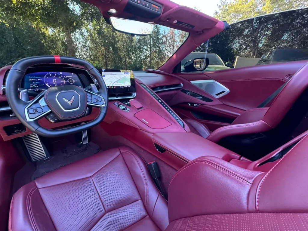 Interior of a 2022 Chevrolet Corvette Stingray Convertible 3LT Z51 with red leather seating.