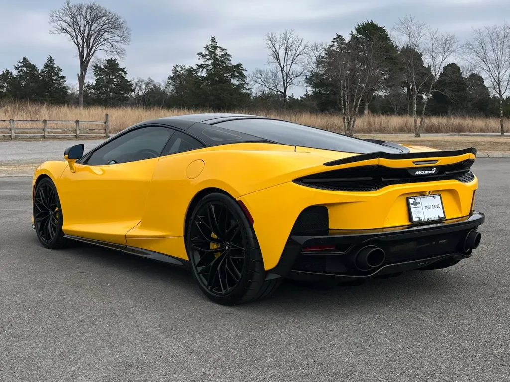 Rear exterior view of a 2022 McLaren GT Volcano Yellow