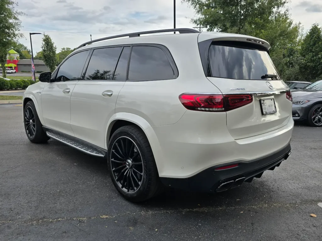 Rear exterior of 2022 Mercedes-Benz GLS 63 AMG in white showing AMG badging, quad exhausts, and sleek LED taillights.