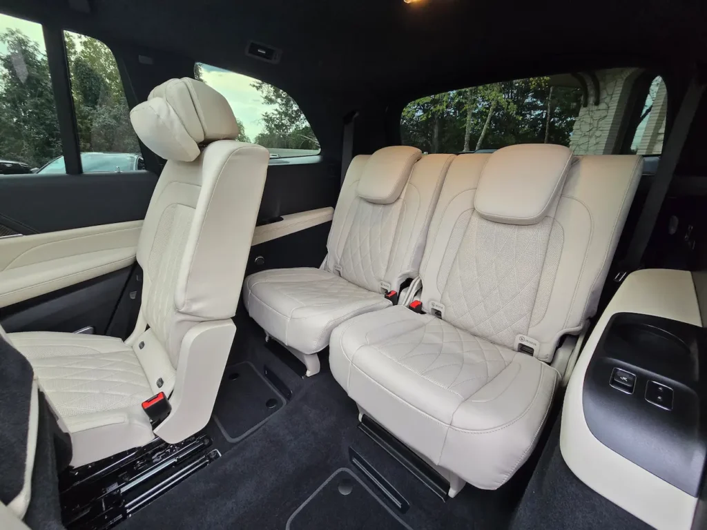 Third-row seats of 2022 Mercedes-Benz GLS 63 AMG with foldable leather seating and premium stitching.