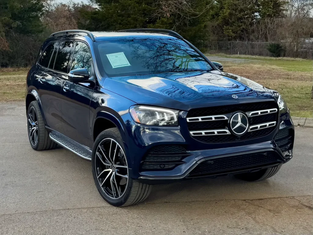 2022 Mercedes-Benz GLS 450 in deep blue, parked in a scenic outdoor location.