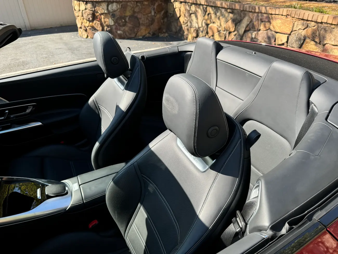 2022 Mercedes-AMG SL55 Roadster interior rear seats in black leather with AMG detailing.