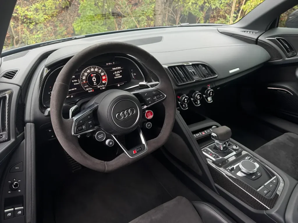 2023 Audi R8 Spyder cockpit with digital cluster and performance steering wheel