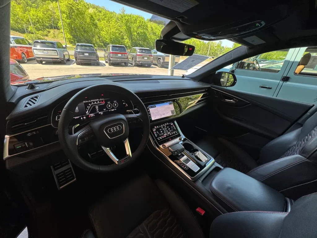 2023 Audi RS Q8 interior with digital cockpit and black sport seats