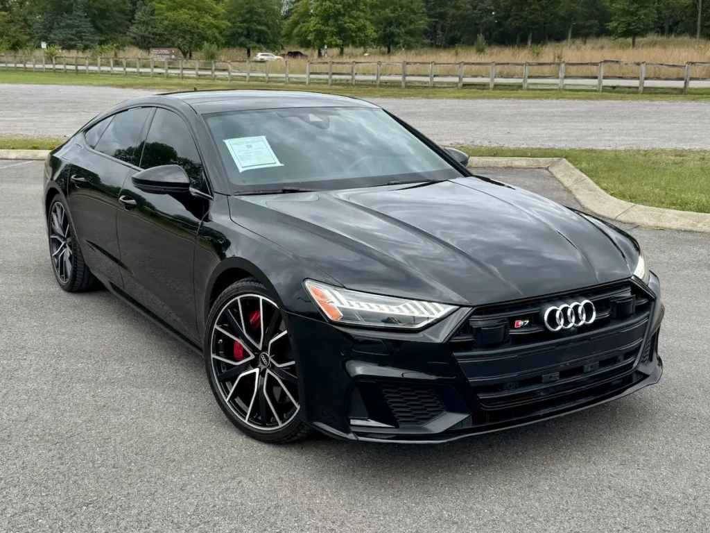 2023 Audi S7 in black shown from the front with aggressive grille and sport styling.