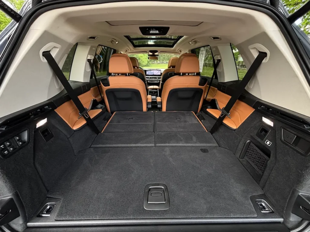 2023 BMW X7 xDrive40i cargo area with rear seats folded for added storage space