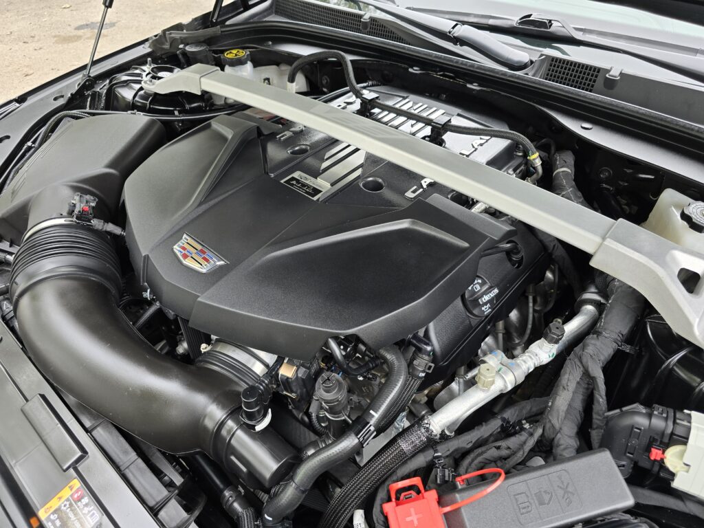 2023 Cadillac CT5-V Blackwing supercharged 6.2L V8 engine bay with performance bracing and premium components.