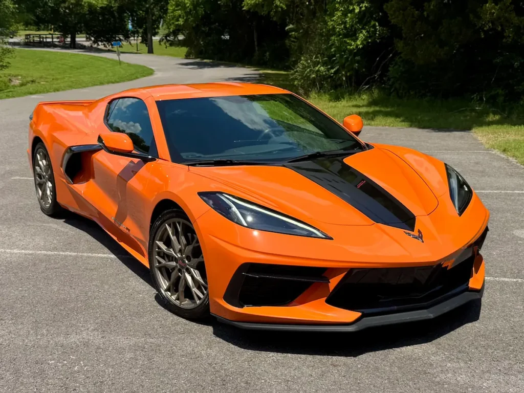 2023 Chevrolet Corvette Stingray R in bright orange with black accents parked outdoors at AutoPro Nashville.