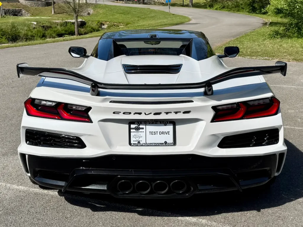 Rear view of a white 2023 Chevrolet Corvette Z06 70th Anniversary Edition with large rear wing.