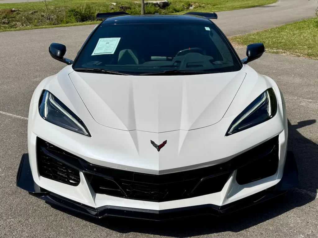 Front view of a white 2023 Chevrolet Corvette Z06 70th Anniversary Edition with black aero trim.