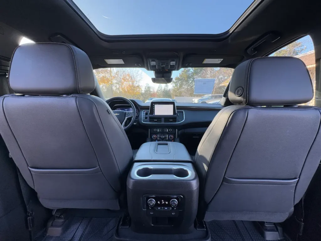 Second-row seating of a 2023 Chevrolet Suburban High Country with premium black leather.