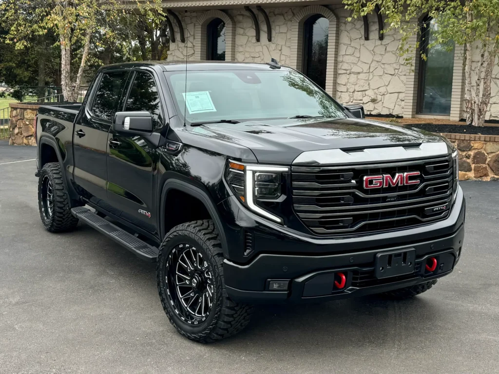 The 2023 GMC Sierra Black AT4 parked at AutoPro Nashville, showcasing its rugged design.