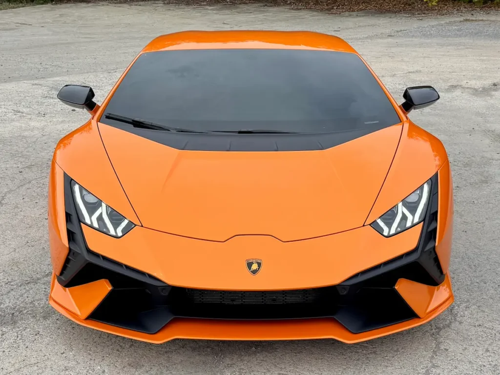 2023 Lamborghini Huracan orange front exterior, used exotic sports car example
