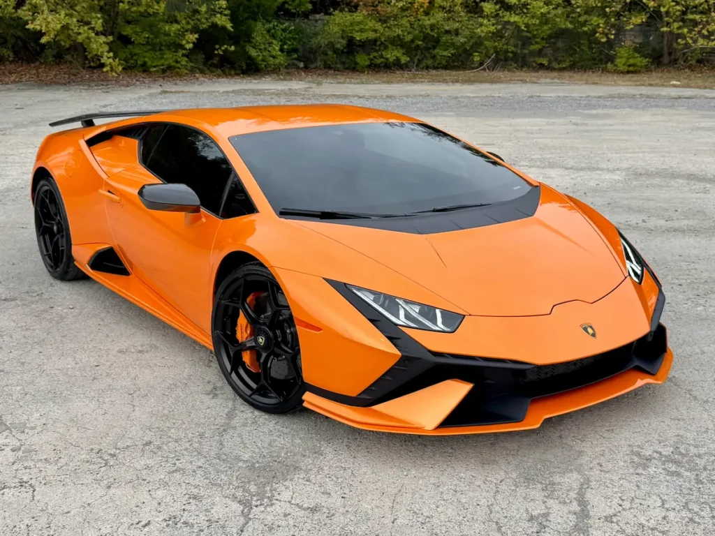 Front exterior view of a 2023 Lamborghini Huracán in orange