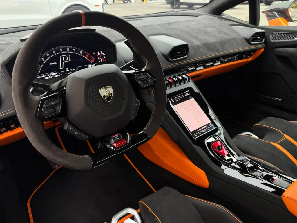 2023 Lamborghini Huracan cockpit with digital display and performance steering wheel