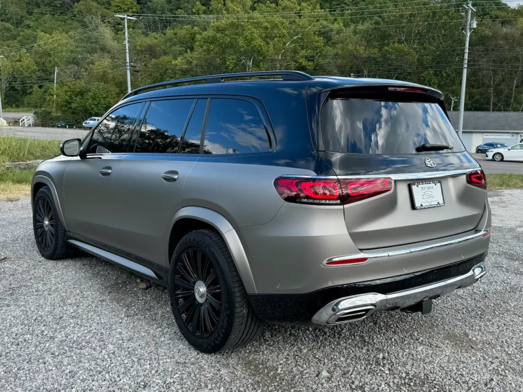 Rear exterior of 2023 Mercedes-Benz GLS 600 Maybach in matte gray two-tone wrap with chrome trim and AMG-style exhaust finishers.
