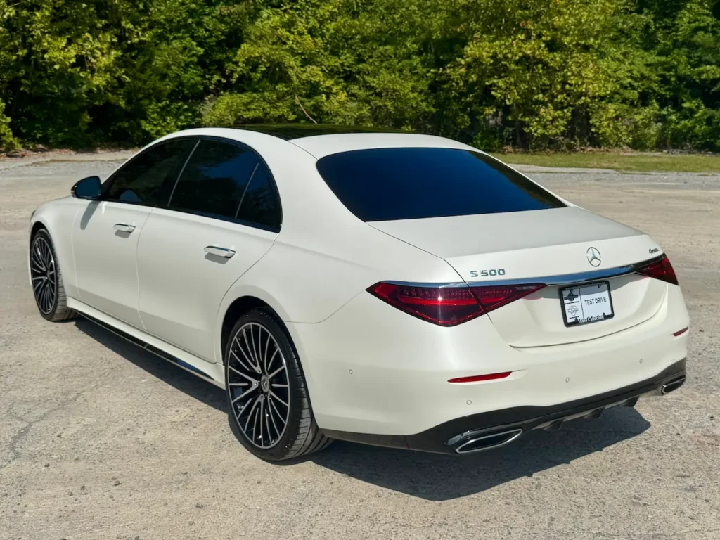 Rear view of the 2023 Mercedes-Benz S500 in white highlighting LED taillights and chrome accents.