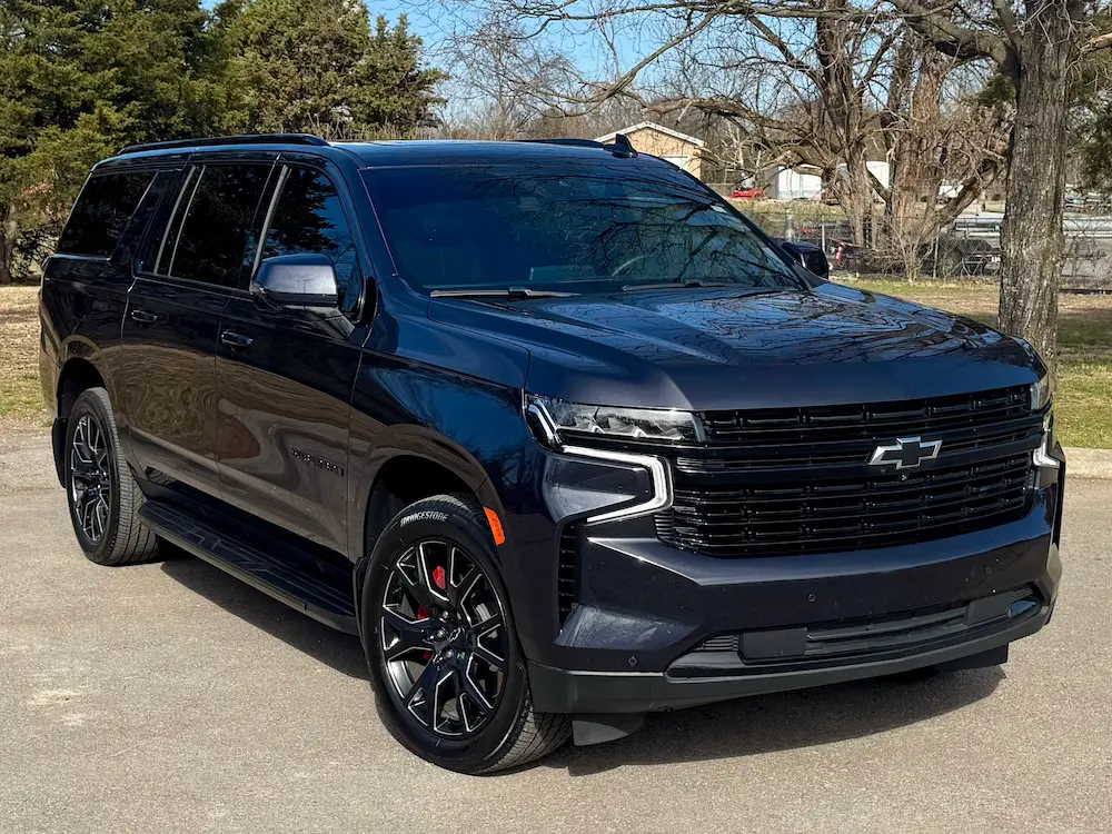 Used Chevrolet Suburban full-size SUV in black with premium design