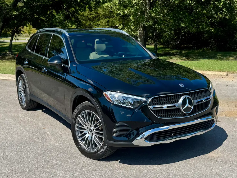 2025 Mercedes-Benz GLC 300 SUV in black featuring modern grille and chrome trim.