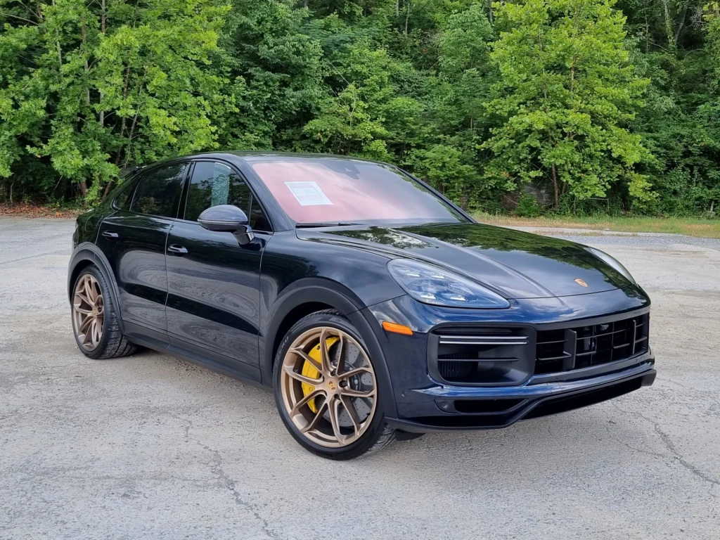 2023 Blue Porsche Cayenne SUV at AutoPro Nashville dealership.