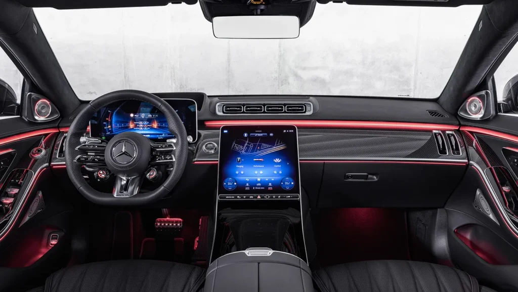 Interior view of the Mercedes-AMG S63 E Performance Sedan showcasing its luxurious seats, ambient lighting, and advanced technology.