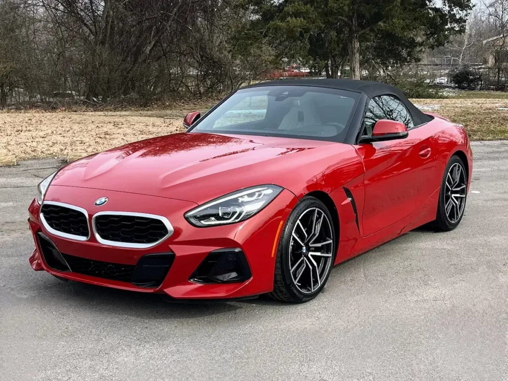 2024 BMW Z4 red convertible front view with black soft top