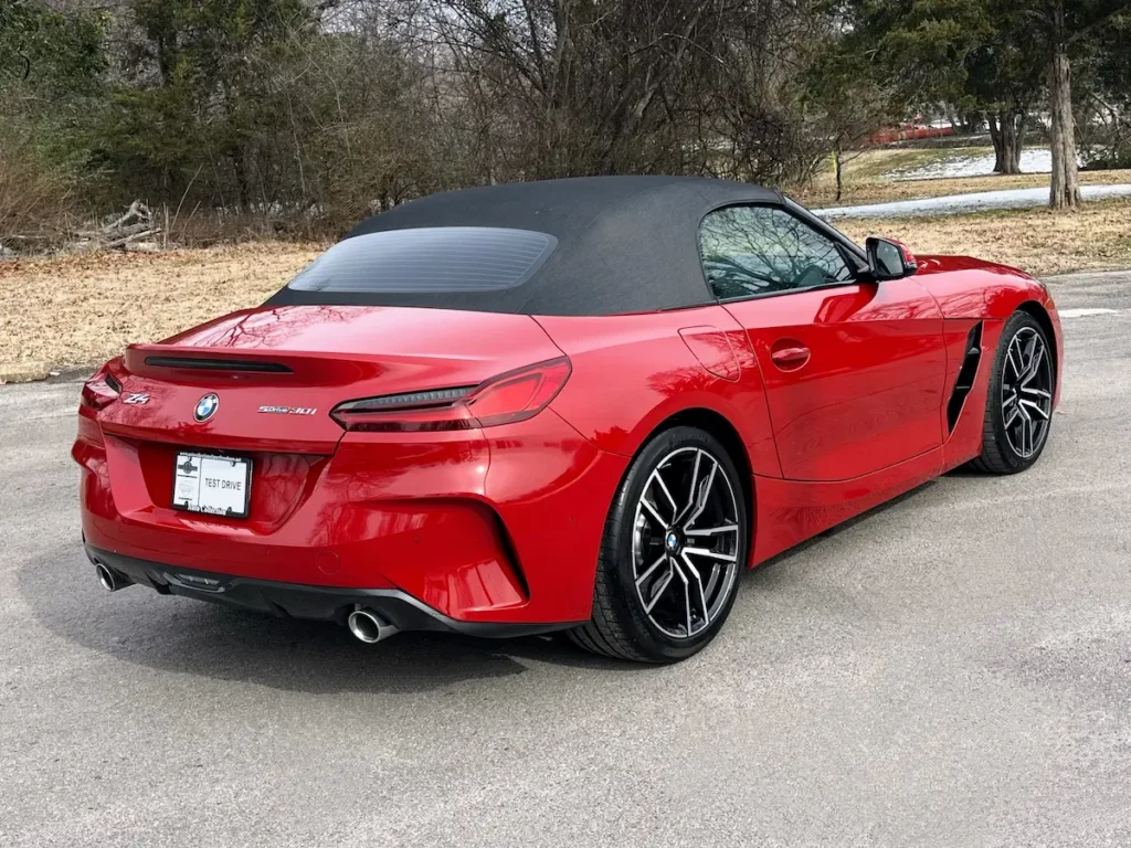2024 BMW Z4 red convertible rear view with black soft top