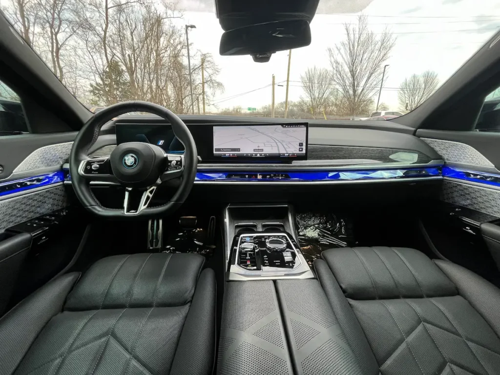 2024 BMW i7 interior with digital dashboard and ambient lighting